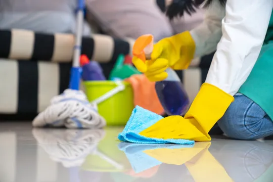 Person Cleaning Floor With Cloth And Spray — Omaha, NE — All Clean LLC